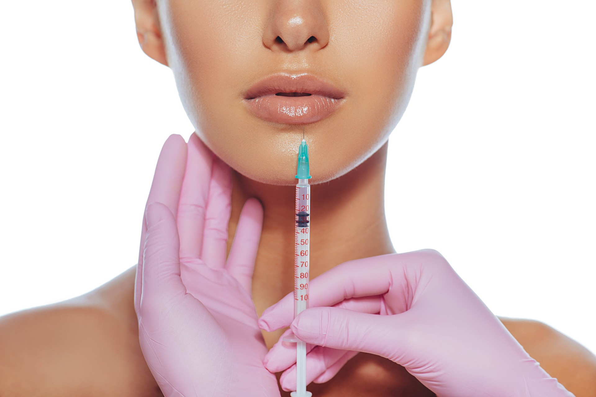 Cropped sensual female lips, procedure lip augmentation. Syringe near womans mouth, injections for increase lips shape